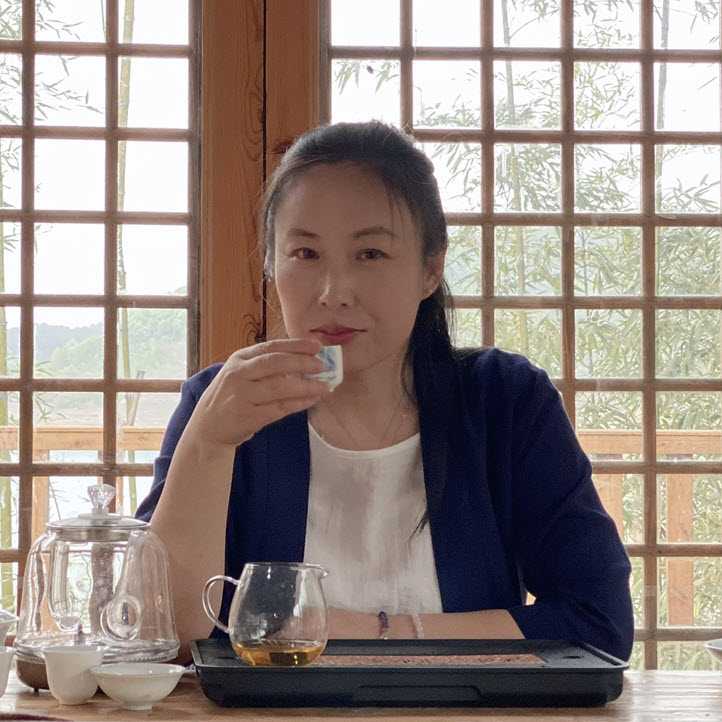 Dr. Ming Way having tea